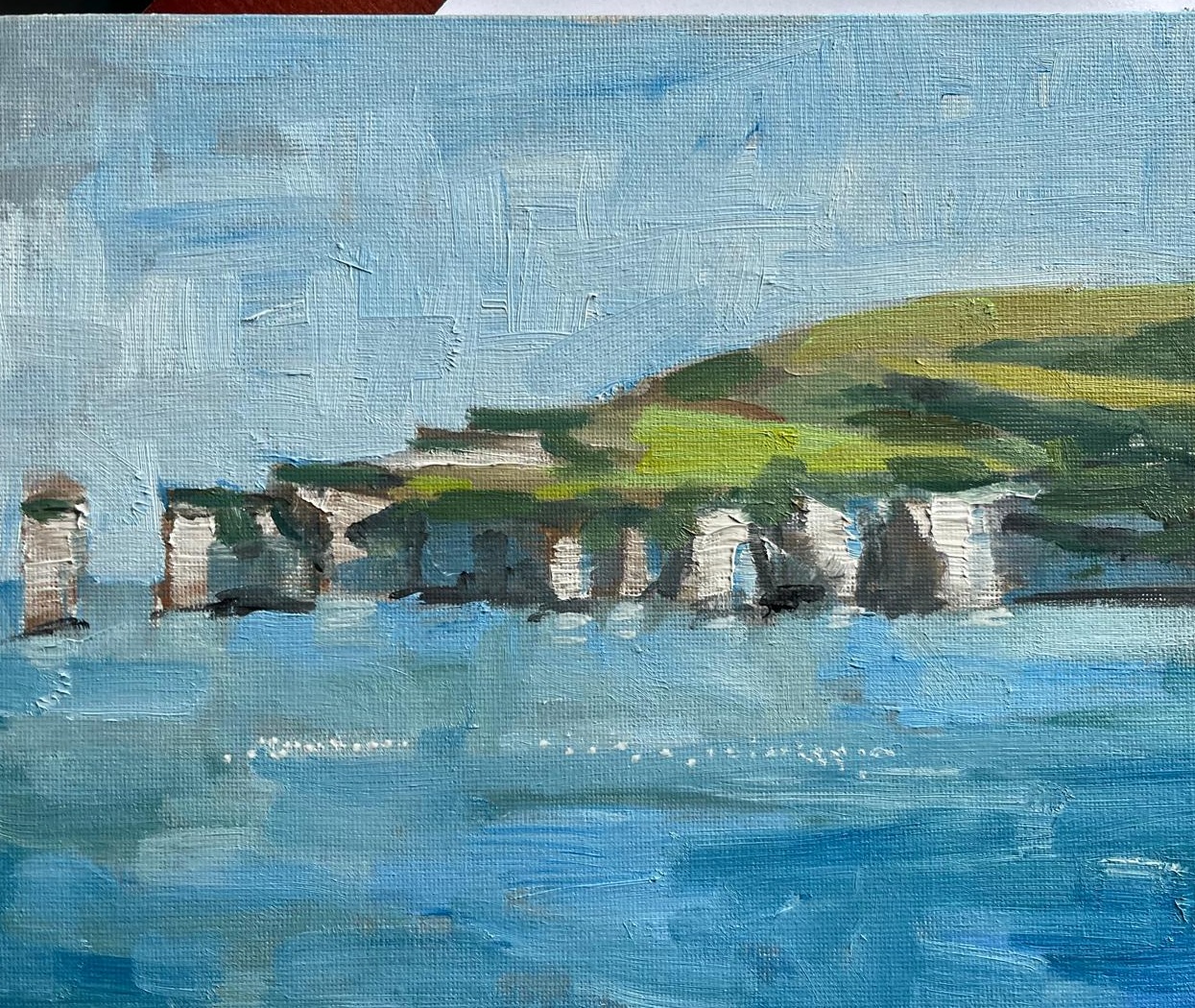 Oil painting of chalk cliffs and blue sea