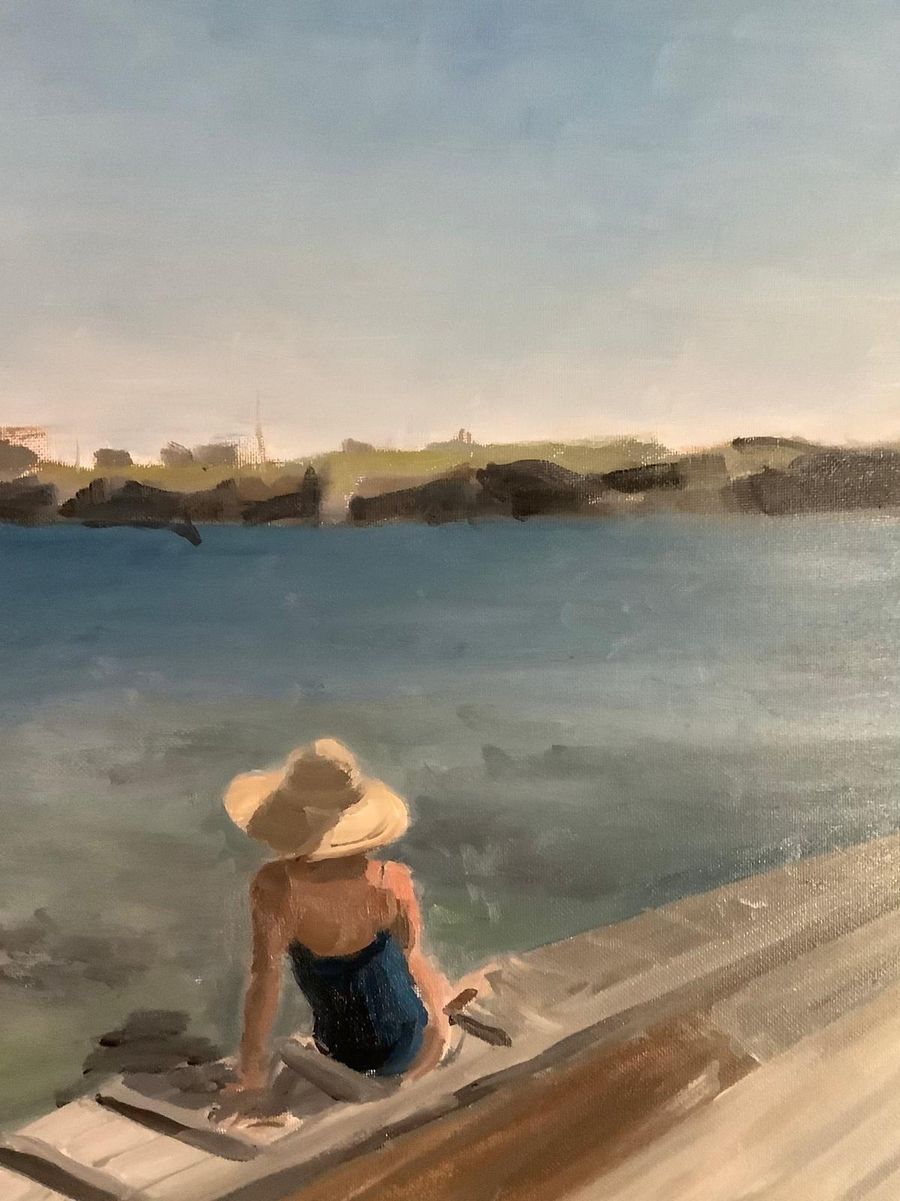 Oil painting of a figure in a hat sitting on a dock overlooking the water